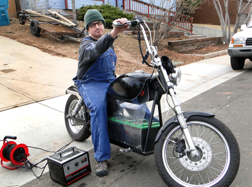 Chris Ravana on an electric motorcycle