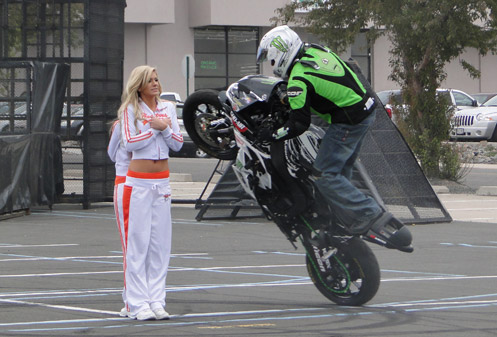 Stunt rider circles Hooters girls