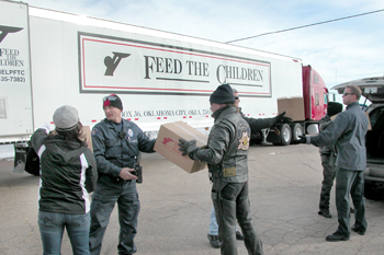 unloading food for needy families