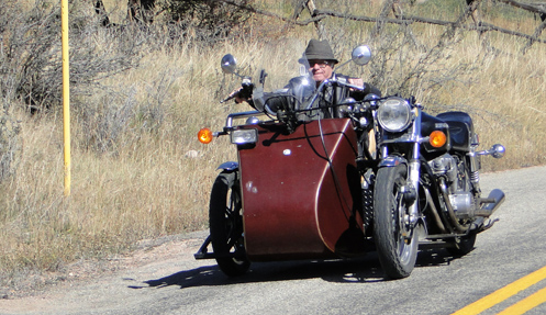 Glyn McDowell driving his rig from the sidecar